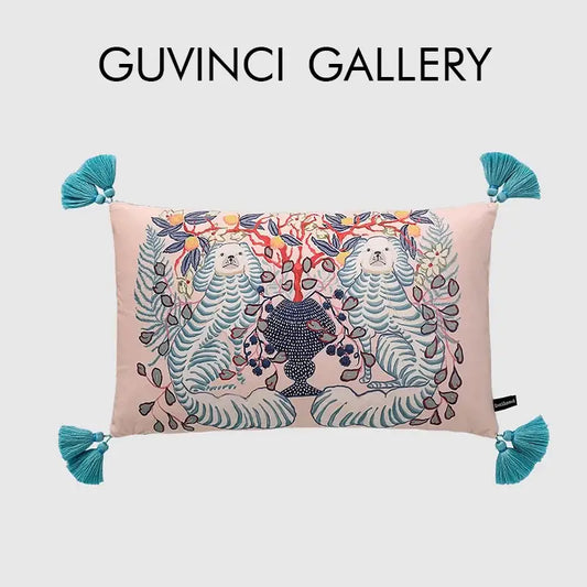 Pink rectangular lumbar pillow cover with embroidered white lion dog and blue lion vase design with teal tassels