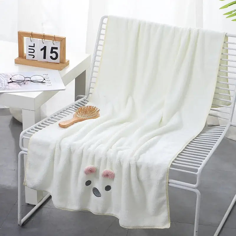 A soft white face towel with a cute embroidered bear face and pink pom-pom ears for decorbites cartoon soft hand use