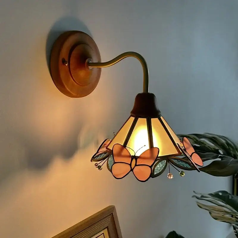 Antique brass wall sconce with stained glass shade featuring orange and green butterfly motifs for bedroom decorbites glass led wall light