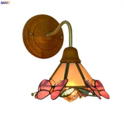 A warm-toned glass led wall sconce with pink butterfly motifs and a brass-finished decorbites glass led bracket