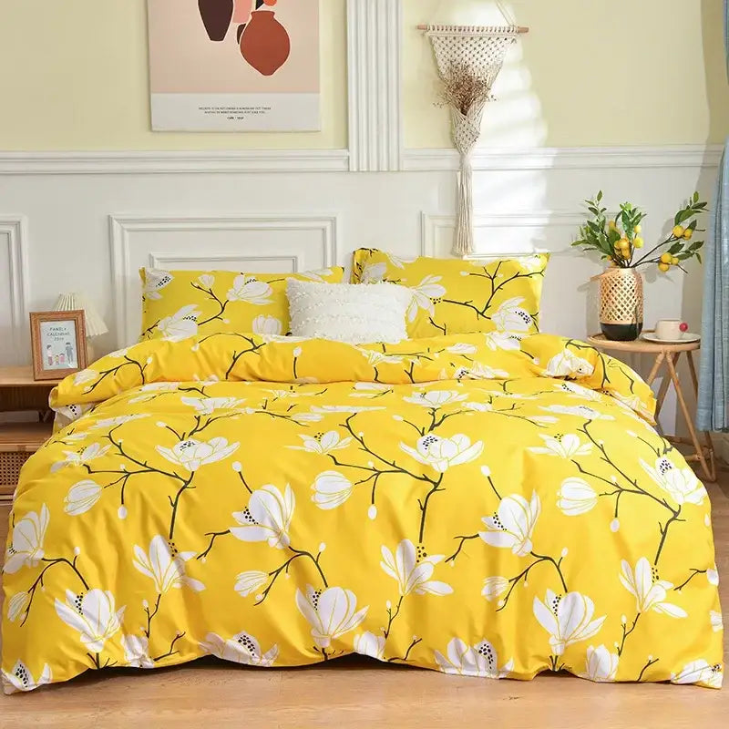Bright yellow bedding set with bold white magnolia floral pattern and black branches in butterfly print bedding collection