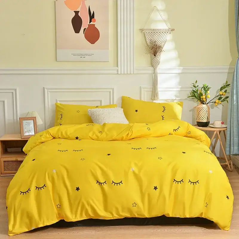 Bright yellow bedding set with playful black embroidered eyes and stars for a pink butterfly print bedding bedroom