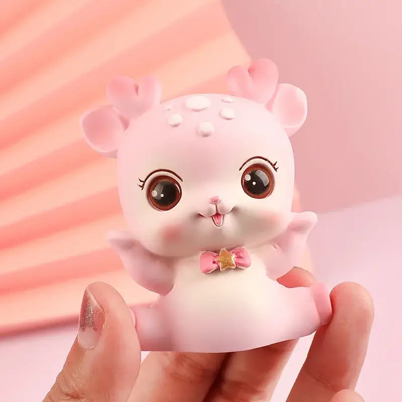 Pink cartoon deer resin figurines featuring a cute deer with large brown eyes and tiny antlers for bedroom decorbites decor
