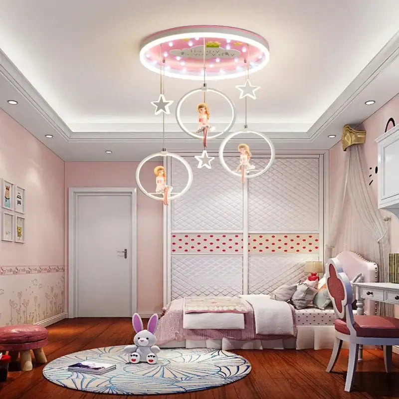 Pink cartoon princess kids room chandelier with led rings featuring glowing stars and suspended doll figures decorbites cartoon princess