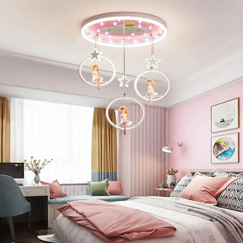 Pink cartoon princess kids room chandelier with glowing led ring and hanging fairy dolls by decorbites cartoon princess
