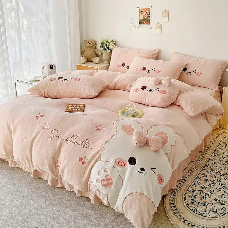 Pink plush bunny-themed bedding set with cartoon rabbit applique embroidered details and ruffled skirt by decorbites