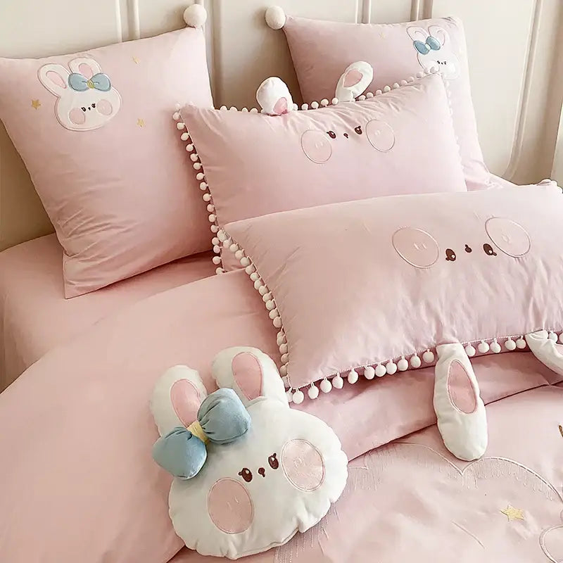 Soft pink cartoon rabbit moon cotton bedding set with embroidered bunny faces and pom pom trim for bedroom decorbites