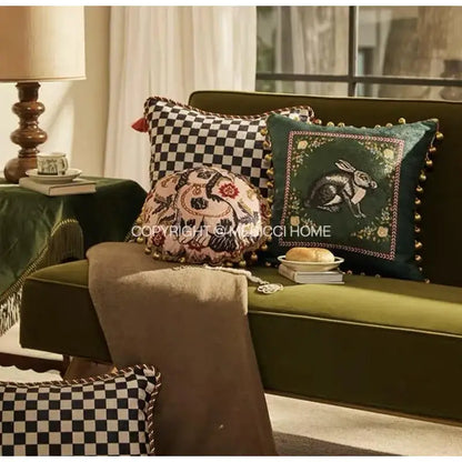 Emerald green velvet cushion with embroidered rabbit and gold pom-pom trim for decorbites cat print velvet decor
