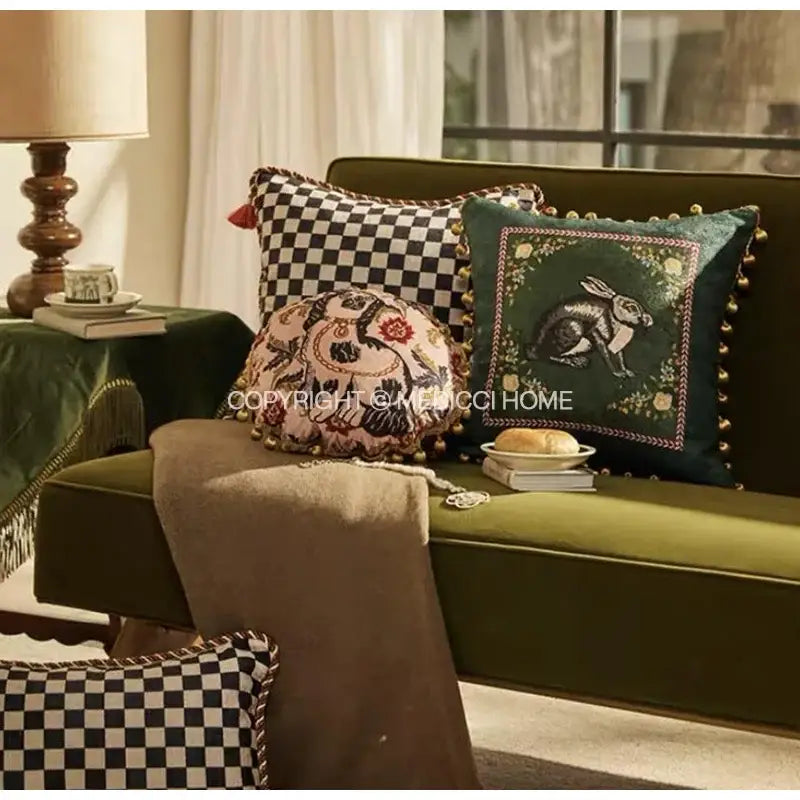 Emerald green velvet cushion with embroidered rabbit and gold pom-pom trim for decorbites cat print velvet decor