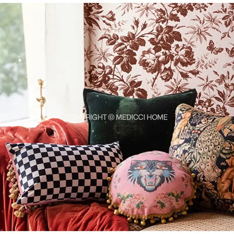 Pink circular velvet throw pillow case with embroidered tiger face floral pattern and gold pom-poms decorbites cat print