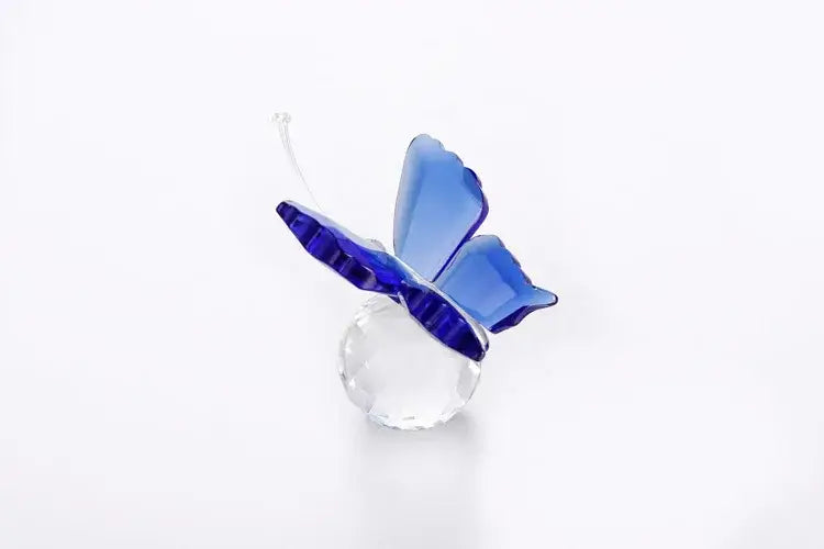 Translucent blue decorbites crystal butterfly figurine with layered wings on a faceted crystal base for bedroom decor