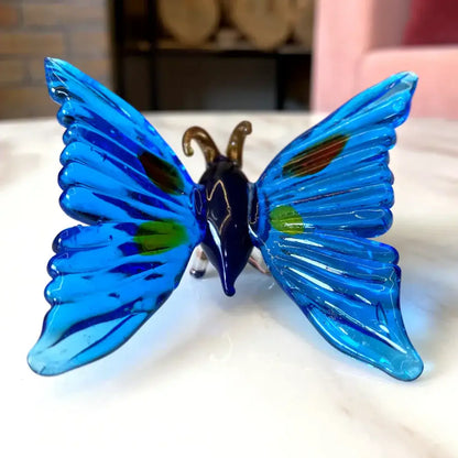 Vibrant blue glass crystal butterfly figurine with iridescent green and gold accents for bedroom decorbites decor