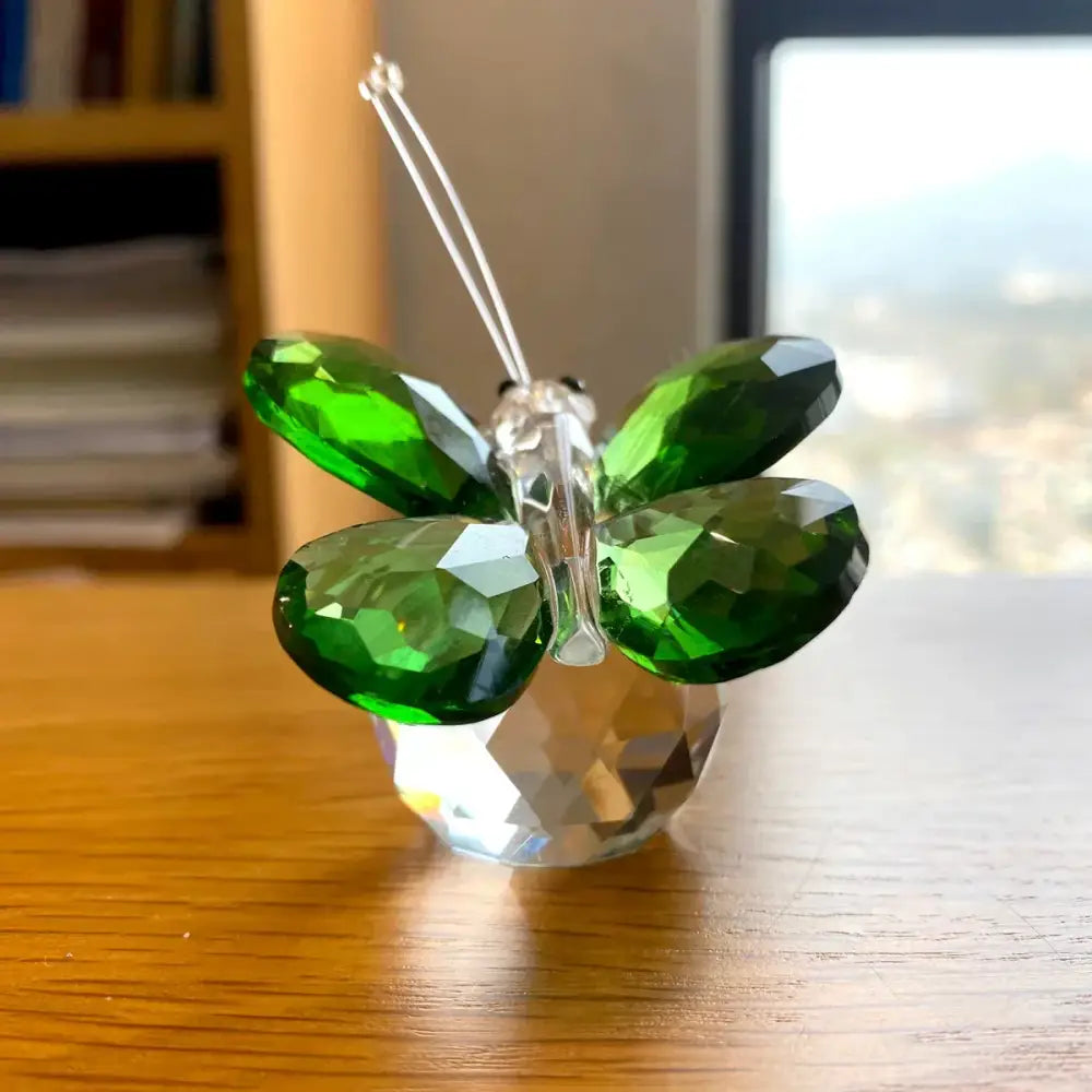A sparkling green crystal butterfly figurine with clear wings and faceted base for bedroom decorbites decor