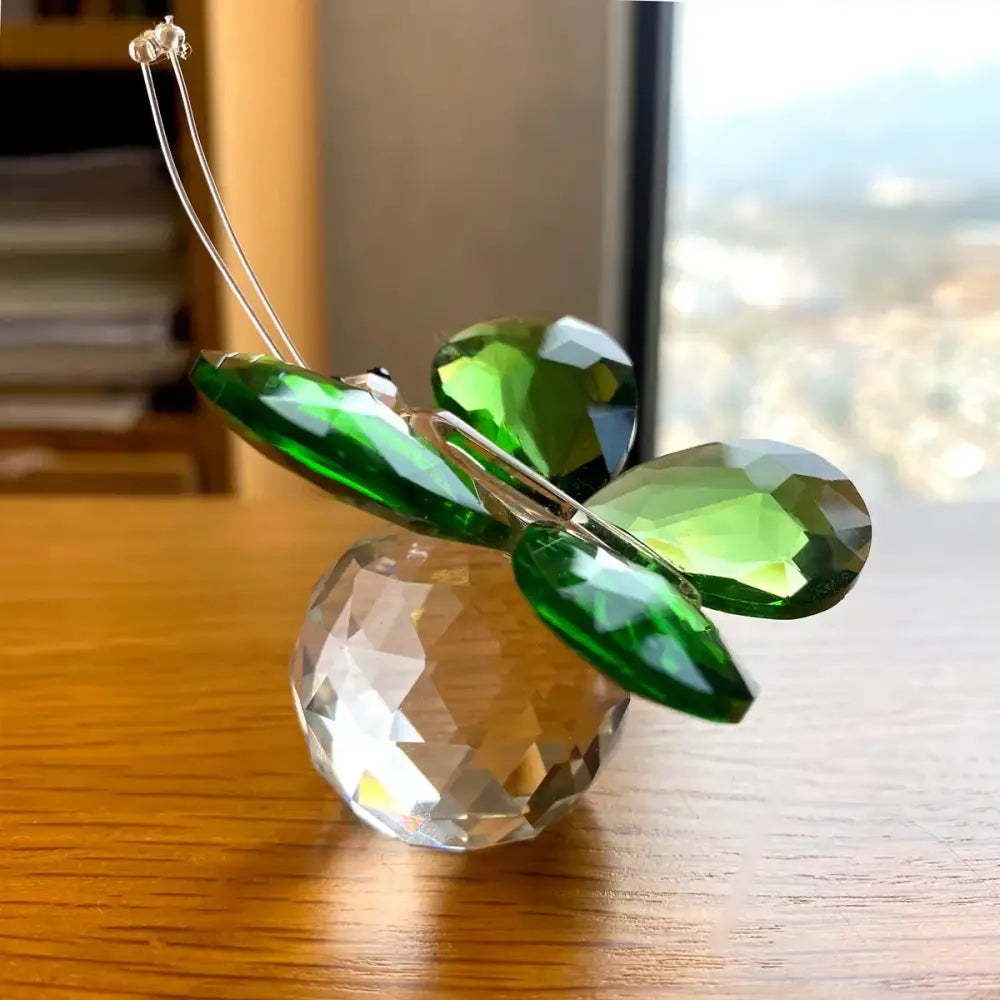 Green crystal butterfly figurine with faceted wings on clear spherical base for bedroom decor by decorbites crystal butterfly