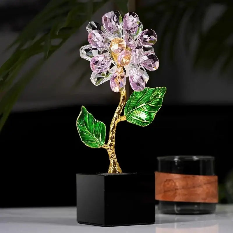 A delicate pink and clear crystal sunflower metal sculpture with golden stem and green leaves for home decor by decorbites crystal sunflower
