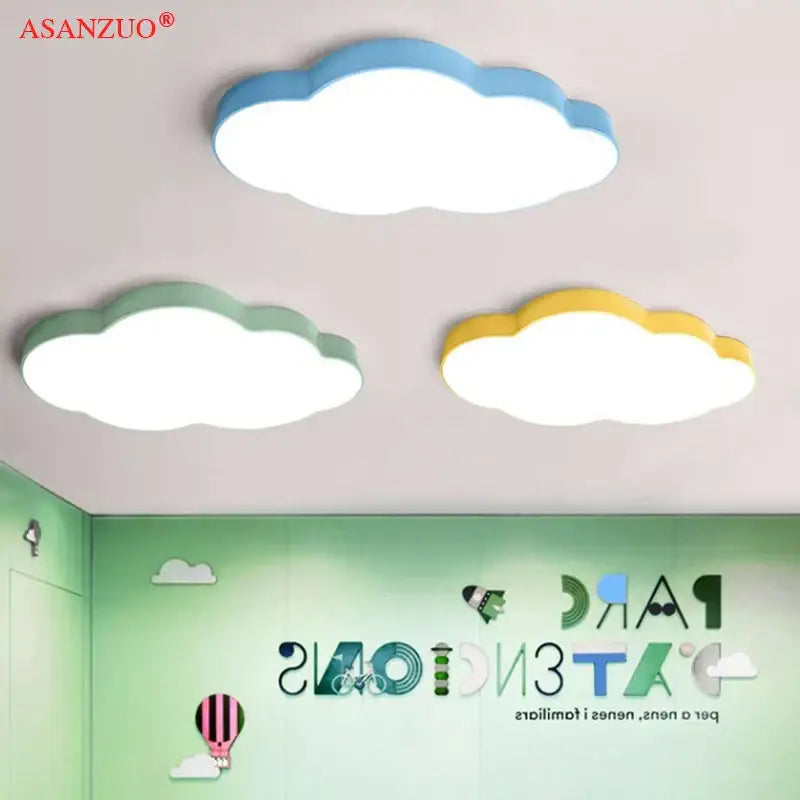 Pink cloud led kids ceiling light fixture with three cloud-shaped blue green and yellow decorbites cloud led lights