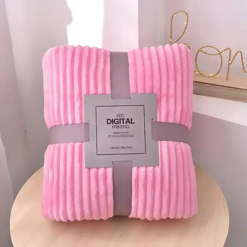 Pink cozy striped flannel fleece bedroom throw blanket with soft pink corduroy texture wrapped in gray ribbon