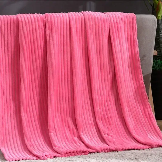 A plush vibrant pink cozy striped flannel fleece blanket with ribbed texture for bedroom decorbites cozy striped throw