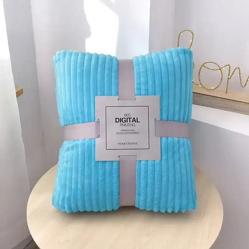 A soft light blue corduroy blanket with plush texture and ribbed stripes perfect for decorbites cozy striped fleece decor