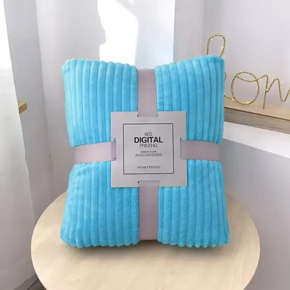A soft light blue corduroy blanket with plush texture and ribbed stripes perfect for decorbites cozy striped fleece decor