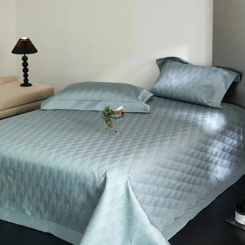 Light blue quilted bedspread set with subtle geometric pattern made of decorbites cool lyocell fiber for bedroom decor