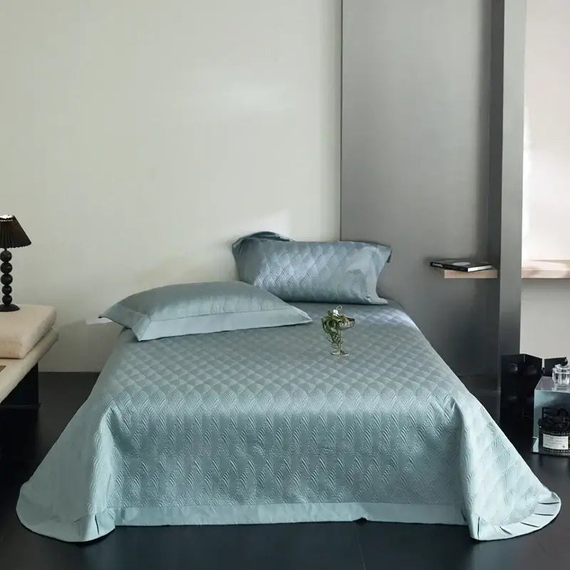 Light blue quilted bedspread set with subtle diamond pattern and ruffled hem made from decorbites cool lyocell fiber