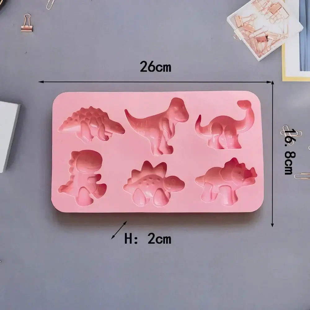 Pink dino silicone cake mold kitchen baking tray with six distinct prehistoric creature cavities for baking use