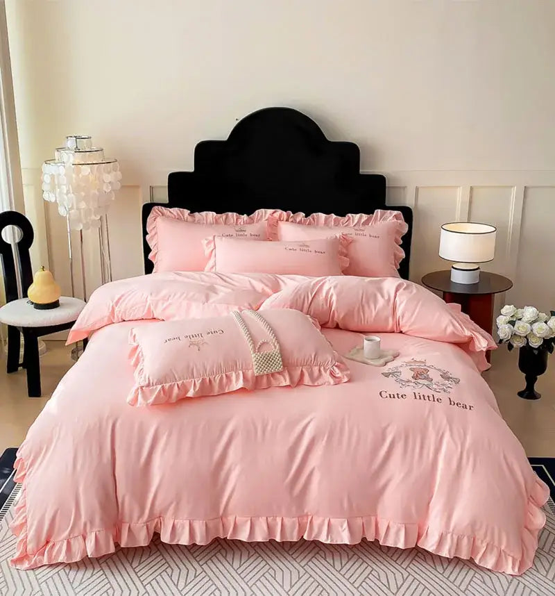 Pink embroidered bear cotton bed skirt set with ruffled design featuring a cute little bear for bedroom use