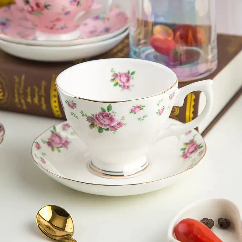 A delicate white porcelain flower tea cup set with pink rose patterns and gold trim for phnom penh afternoon use