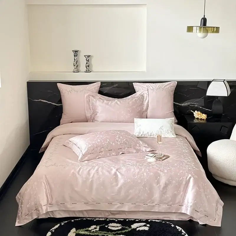Pink satin bedding set with subtle floral embroidery made from egyptian cotton decorbites jacquard 100s fabric