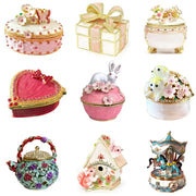 Pink floral heart jewelry trinket box with gold trim and rhinestones as a decorative storage case for jewelry