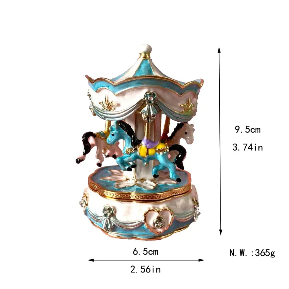 A blue and white carousel music box with gold accents and miniature horses serves as a jewelry trinket box storage case