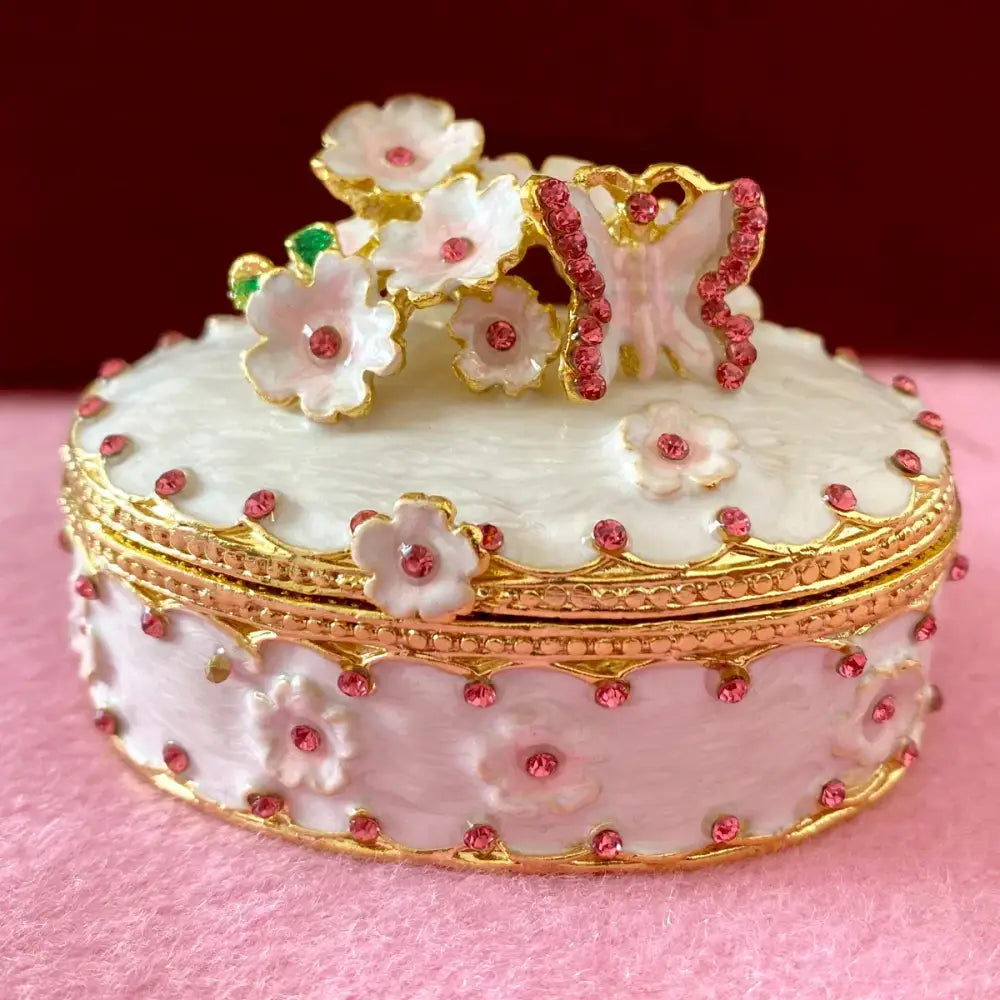 Delicate white and gold jewelry trinket box with pink rhinestones and jeweled butterfly, perfect storage case