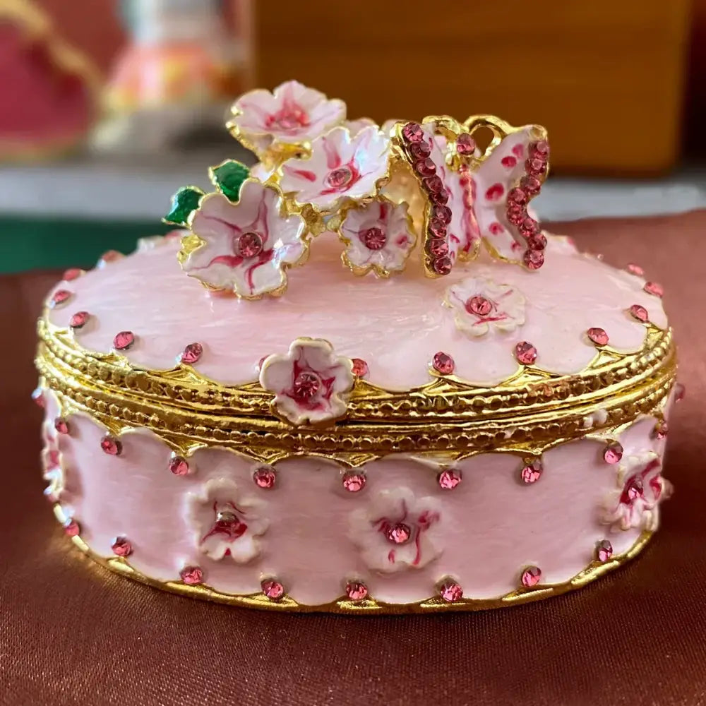 Pink porcelain jewelry trinket box with gold trim floral appliqués and rhinestones for storage case use