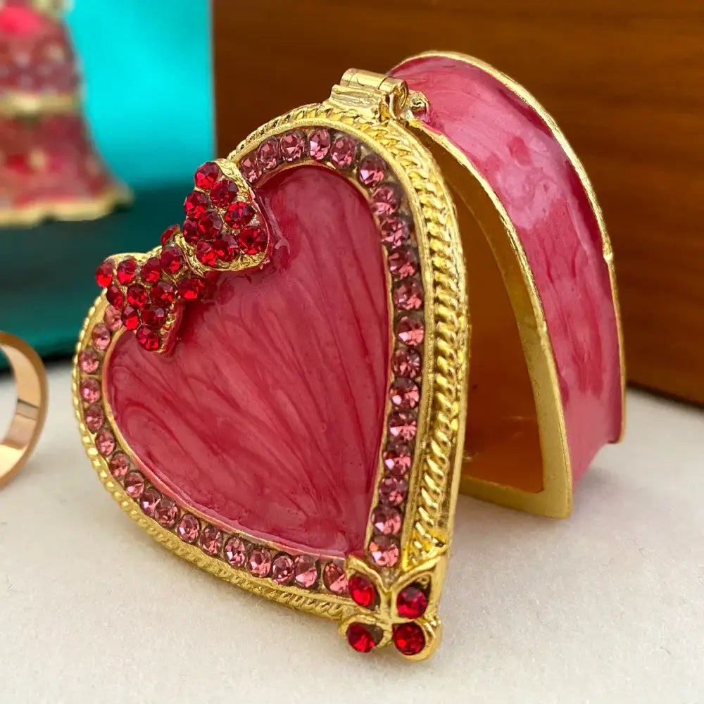 Pink heart-shaped jewelry trinket box with gold trim and red rhinestones for bedroom storage case