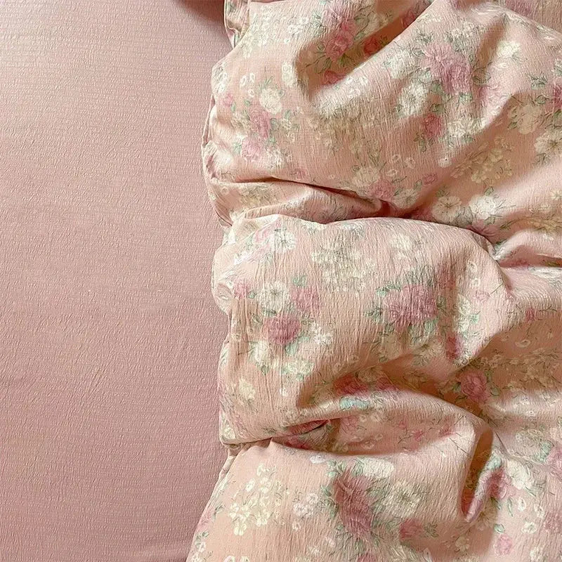Pink floral jacquard fitted sheet set featuring soft blush pink blossoms on lightweight sheer fabric with textured yarn