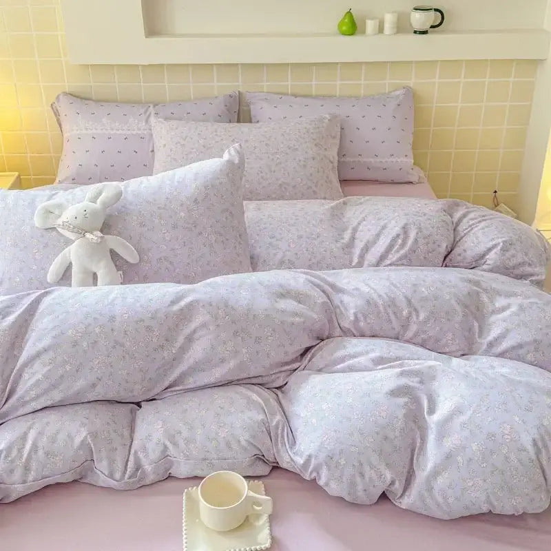 Lavender floral-patterned fitted sheet set with soft plush fabric and subtle pastel detailing for bedroom use