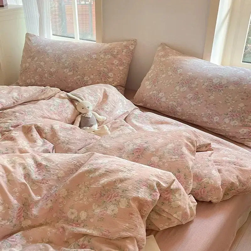 Pink floral jacquard fitted sheet set with soft textured yarn fabric for comfortable bedroom use
