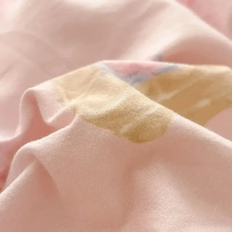 Soft pink cotton comforter set with subtle pale yellow and muted blue floral pattern for decorbites cozy cartoon printed design