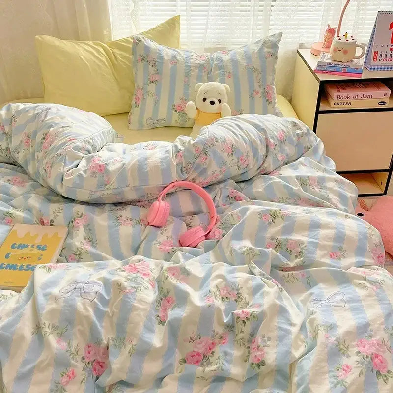 Light blue and white striped cotton comforter set with pink floral embroidery and bow details from decorbites cozy cartoon printed