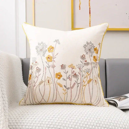 Cream-colored cushion cover with intricate pink flower farmhouse embroidery and yellow piping for living room decorbites 3d pink decor