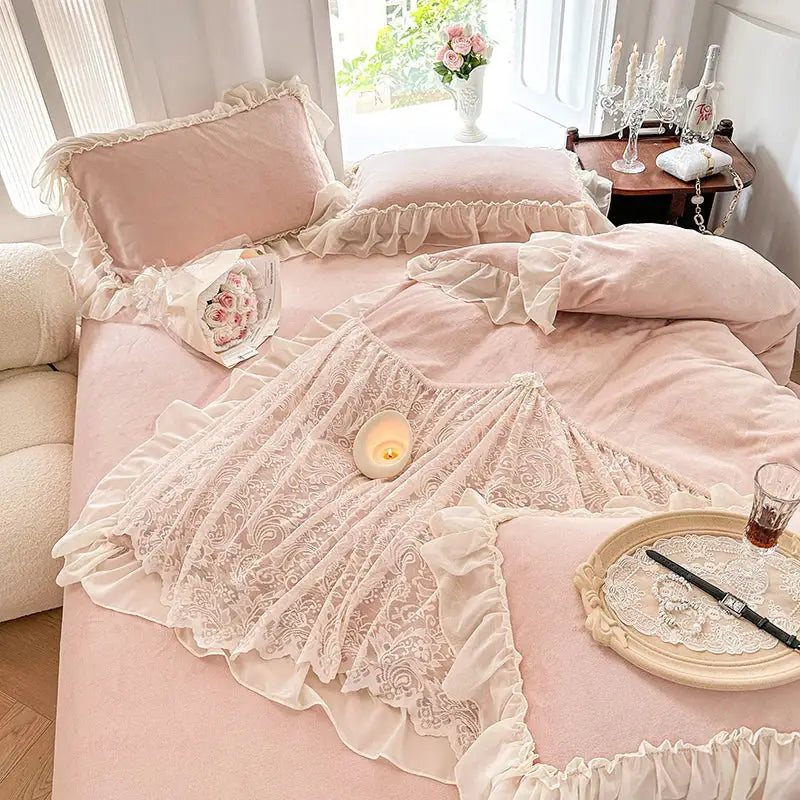 A delicate ivory french lace ruffles bedding set with floral patterns layered over blush pink velvet decorbites duvet