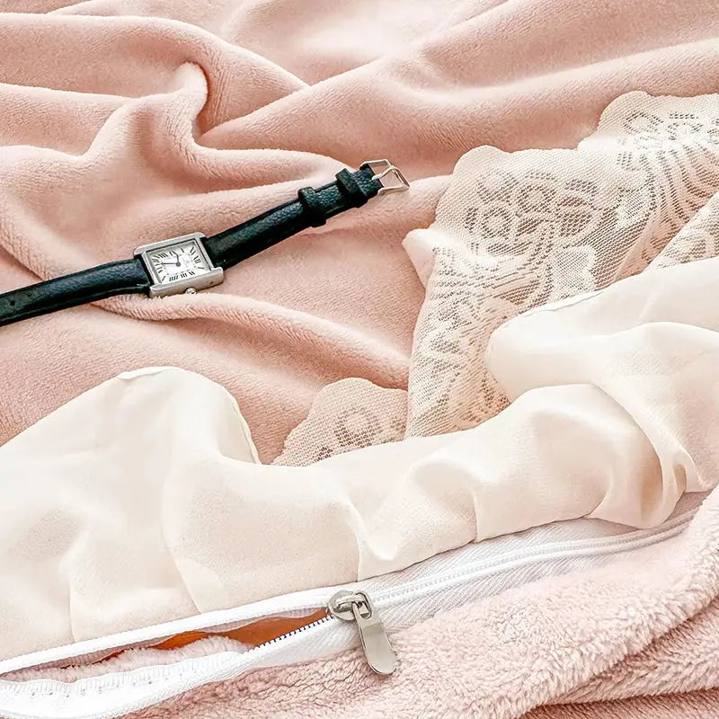 A sleek silver watch with a black leather strap on soft pink fabric complements the decorbites french lace ruffles bedding set