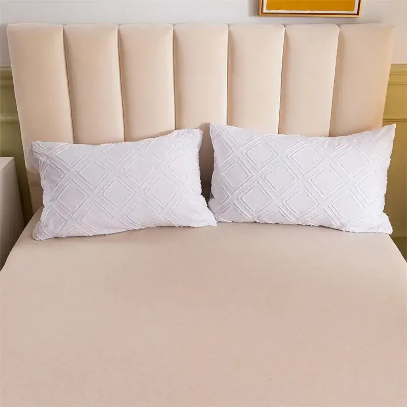 White pillows with a textured diamond pattern complementing pink geometric cut flowers bedding set decorbites decor