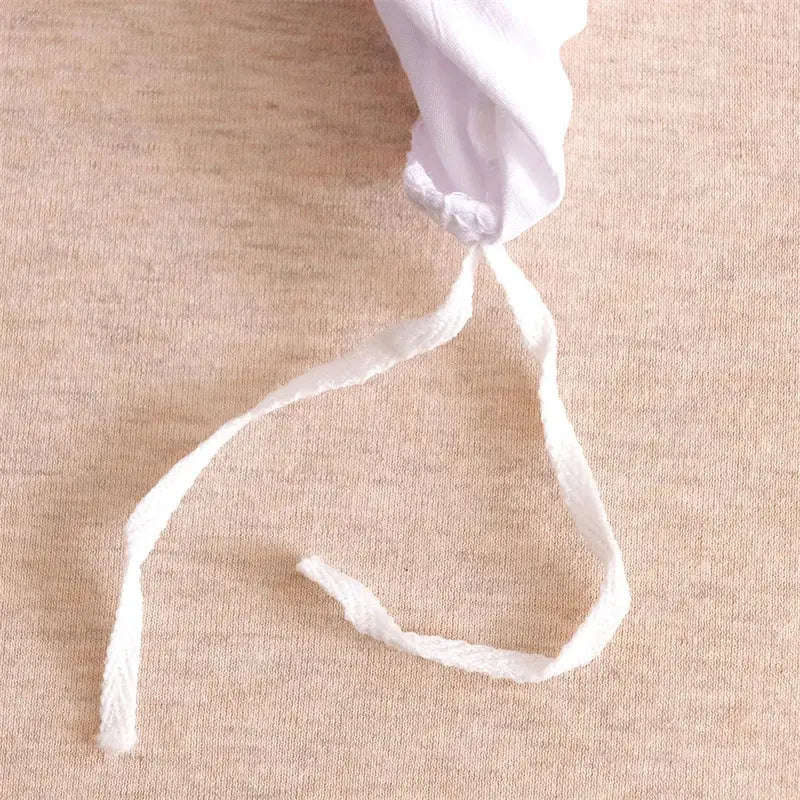 White cotton drawstring detail on the back of pink geometric cut flowers quilted bedding set by decorbites