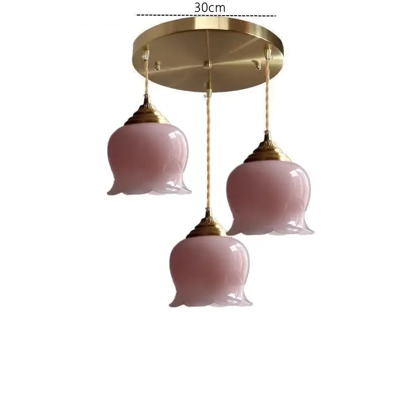 Pink tulip-shaped glass copper led pendant light with gold fixtures and braided cords for kitchen decor