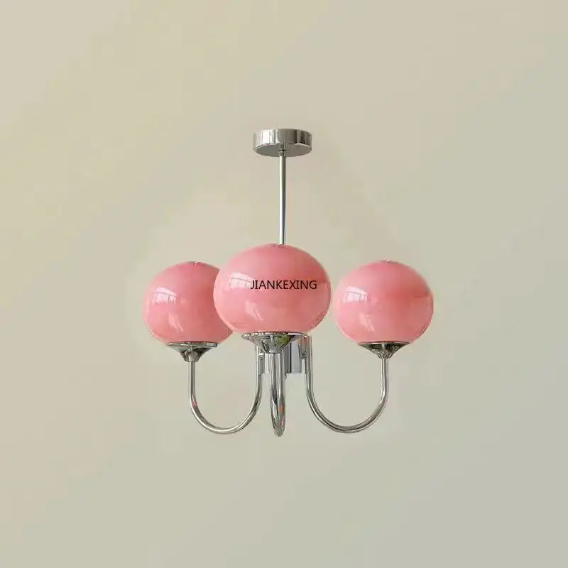 Retro-style pink glass globe pendant lights with three glossy spheres and polished chrome arms by decorbites designer loft