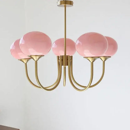 Delicate brass pendant lights with five translucent pink glass globe shades from decorbites designer loft pendant collection