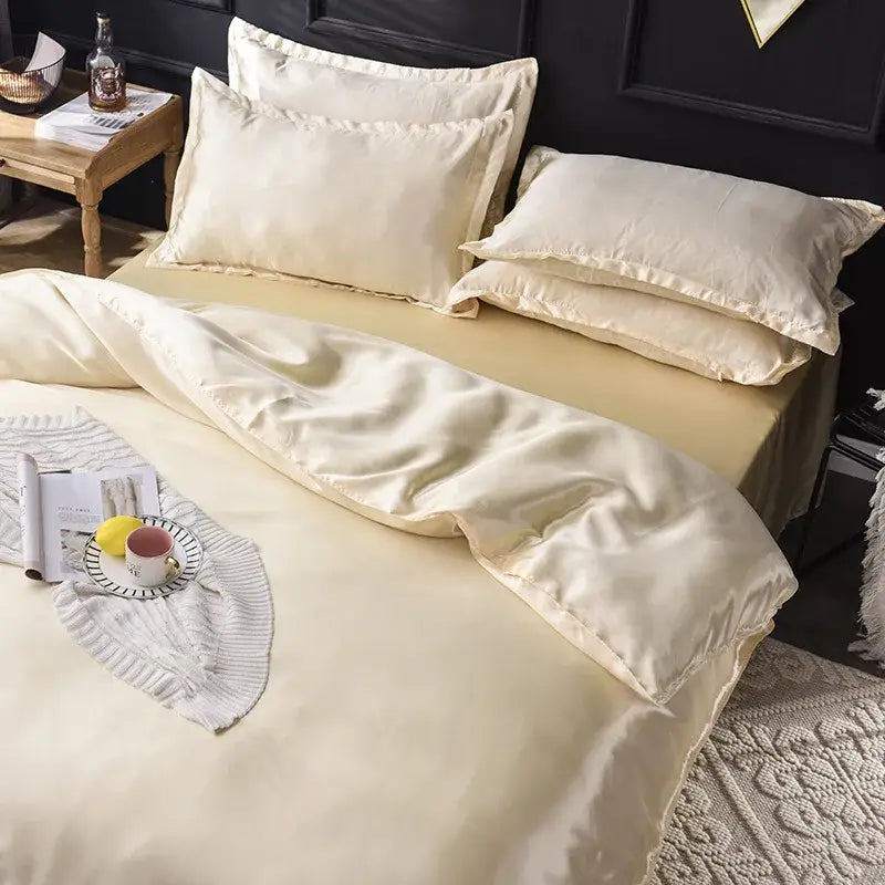 Cream-colored ice rayon satin bedding set with smooth glossy finish and elegant stitched edges for cooling comfort