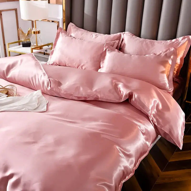 Pink satin bedding set with ice rayon satin material and glossy finish featuring matching pillows for cooling comfort